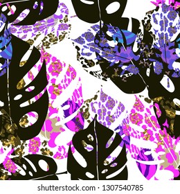 Seamless abstract pattern with tropical leaves and jaguar spots.