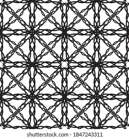 Seamless abstract pattern.Black lace on white background.Black and white graphics. Imitation lace. For design and decoration of fabric, paper, Wallpaper and packaging.Grid pattern.