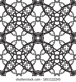 Seamless abstract pattern.Black lace on white background.Black and white graphics. Imitation lace. For design and decoration of fabric, paper, Wallpaper and packaging.Grid pattern.
