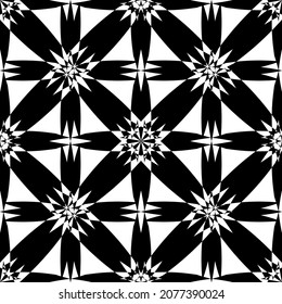 Seamless abstract pattern.Black lace on white background.Black and white graphics. Imitation lace. For design and decoration of fabric, paper, Wallpaper and packaging.Grid pattern.