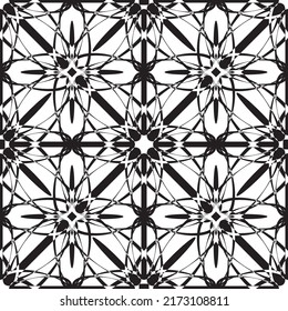Seamless abstract pattern.Black lace on white background.Black and white graphics. Imitation lace. For design and decoration of fabric, paper, Wallpaper and packaging.Grid pattern.