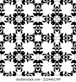 Seamless abstract pattern.Black lace on white background.Black and white graphics. Imitation lace. For design and decoration of fabric, paper, Wallpaper and packaging.Grid pattern.
