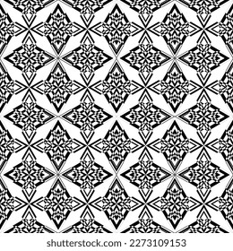 Seamless abstract pattern.Black lace on white background.Black and white graphics. Imitation lace. For design and decoration of fabric, paper, Wallpaper and packaging.Grid pattern.
