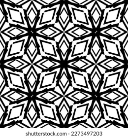 Seamless abstract pattern.Black lace on white background.Black and white graphics. Imitation lace. For design and decoration of fabric, paper, Wallpaper and packaging.Grid pattern.
