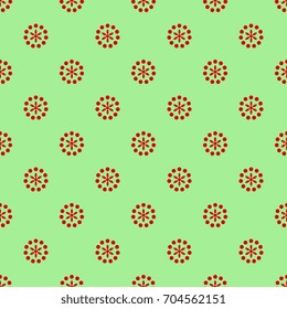Seamless abstract polka dot pattern with round floral motifs. Red motifs on green background.