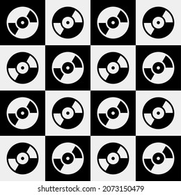 Seamless abstract retro musical pattern with black and white vinyl records.Silhouette drawing , disk CD, plate a dark background.