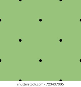 Seamless abstract simple geometrical pattern with small black polka dots on olive green background.