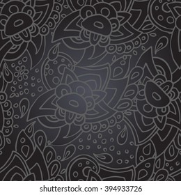 Seamless abstract tracery pattern with floral oriental motifs on a dark gray background with lighting effect. EPS 10.