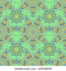Seamless abstract tribal pattern in blue and green colors. Hand drawn ethnic texture, flight of imagination. Vector illustration.