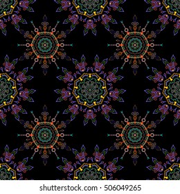 Seamless abstract tribal pattern in green and violet colors. Hand drawn ethnic texture, flight of imagination. Vector illustration.