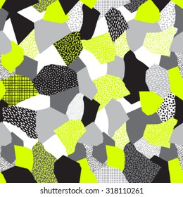 Seamless abstract vector collage of retro 80's Memphis fashion patterns in black, grays and neon yellow.