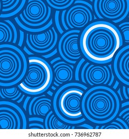 Seamless abstract vector geometric pattern. Ornament made of light blue, dark blue and white circles. Symmetrical layout. Gift wrapping paper. Bed sheets and interior.