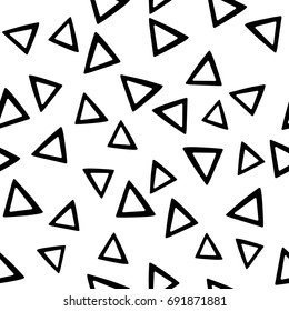 Seamless abstract vector monochrome geometric pattern. Black triangles put randomly on white background. Gift wrapping paper. Bed sheets and interior.