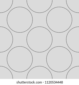 Seamless abstract vintage vector pattern with black dotted circles on grey background. Abstract motif. Can be used for fabric,cloth,textile,wallpaper,templates,scrapbooking,covers and home decor.