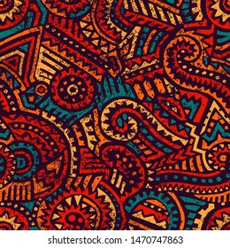 Seamless african pattern. Ethnic and tribal motifs. Orange, red, yellow, blue and black colors. Grunge texture. Vintage print for textiles. Bohemian hand-drawn ornament. Vector illustration.