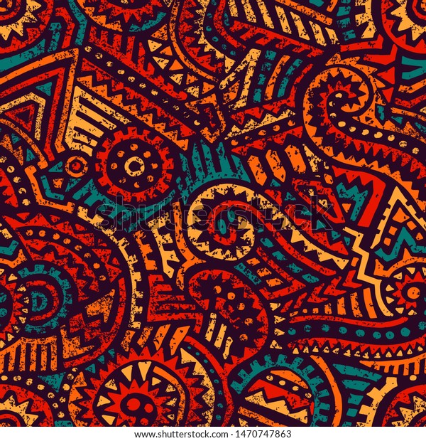 Seamless african pattern. Ethnic and tribal\
motifs. Orange, red, yellow, blue and black colors. Grunge texture.\
Vintage print for textiles. Bohemian hand-drawn ornament. Vector\
illustration.