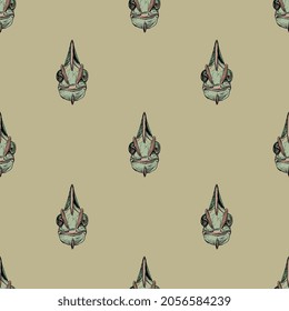 Seamless animal pattern with funny faces of green chameleon lizard. Hand drawn colorful rough sketches on yellow background.