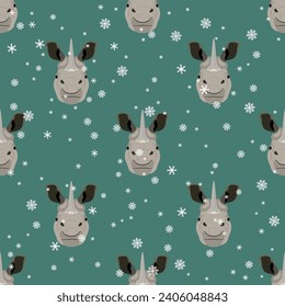 Seamless animal pattern with horned heads of Indian rhinoceros and snowflakes. (Rhinoceros unicornis). Seasonal winter design. Funny animal masks. Cartoon style. On green background.