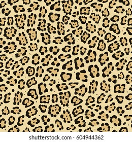 Seamless animal pattern. Imitation print of skin of jaguar. Black and brown spots on beige background.
