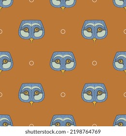 Seamless animal pattern with owl masks. Ancient Egyptian ethnic design. Blue bird faces on orange background. 