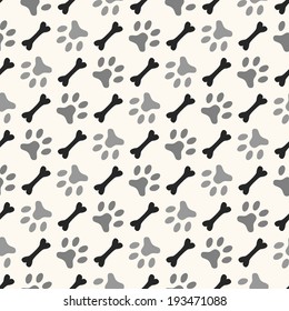 Seamless animal pattern of paw footprint and bone. Endless texture can be used for printing onto fabric, web page background and paper or invitation. Diagonal dog style. White and black colors.