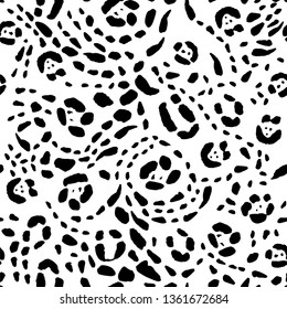 Seamless animal print, black spots on a white background. Stock vector illustration.