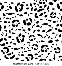 Seamless animal print, black spots on a white background. Stock vector illustration.