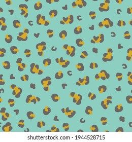 seamless animal skin pattern . blue background. black and gold leopard spots. vector texture. trend print for textiles and wallpaper.