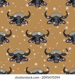 Seamless animal winter pattern with heads of African buffalo and snowflakes. Syncerus caffer. Animal mask. Horned bull. Hand drawn colorful rough sketches. On yellow background.