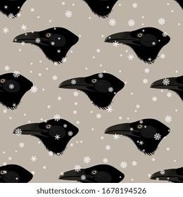Seamless animal winter pattern with raven's head and snowflakes.