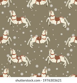 Seamless animal winter pattern with running white horses and snowflakes. On gray background. Merry Christmas motif.