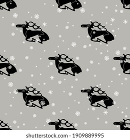 Seamless animal winter pattern with silhouetted elks or deer and snowflakes. Scythian or Permian ethnic style.