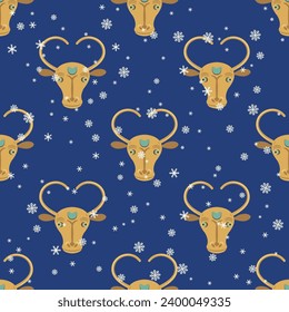 Seamless animal winter pattern with stylized horned heads of a bull or cow and snowflakes. Seasonal Christmas print. Ethnic design from Altyndepe, Turkmenistan. On blue background.