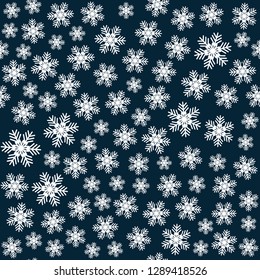 Seamless art pattern with snowflakes on dark blue