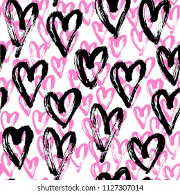 Seamless artistic abstract heart pattern. Hand drawn repeatable creative background. Paint stain grunge design from painted texture. Black, pink and white brush strokes drawing.