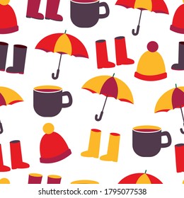 
seamless autumn fall pattern with hat, boots, cup and umbrella.