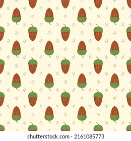 Seamless autumn pattern with acorn on yellow background. Bright fall print for textile and design. Vector flat illustration