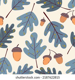 Seamless autumn pattern of acorns and oak leaves on a beige background