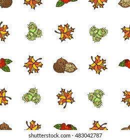 Seamless autumn pattern. Bright autumn leaves, hazelnuts, cranberries and walnuts on white background. Boundless pattern for your design. Fall background.