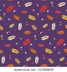 Seamless autumn pattern with colorful red, orange, yellow acacia leaves silhouettes. Bright autumn background for textile print, wallpaper, scrapbooking, wrapping paper. Vector illustration.