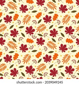 Seamless autumn pattern of leaves, berries and flowers. Vector flat illustration