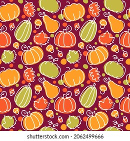 Seamless autumn pattern with pumpkins, maple and oak leaves, acorns and mushrooms