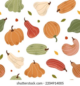 Seamless autumn pattern with pumpkins, squash, zucchini. A mosaic from the harvest for Halloween. White background