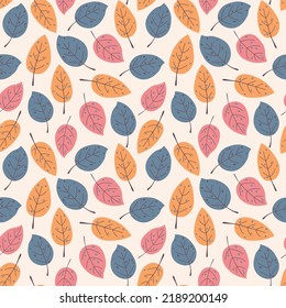 Seamless autumn pattern of simple leaves on a beige background