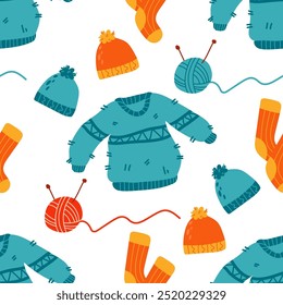 Seamless autumn pattern with  warm knitted clothes, socks, hat, sweater on a white background. Scrapbooking paper and fabric design. Hygge hand drawn vector illustration.