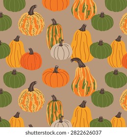 Seamless autumn pumpkin pattern on beige background with assorted squash and gourds