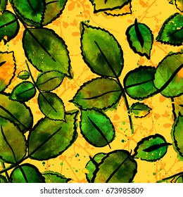 A seamless autumnal pattern with vector freehand watercolour drawings of green leaves and abstract tree branches, hand painted, on a warm yellow background