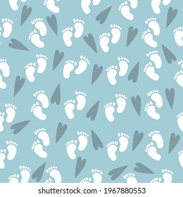 Seamless baby pattern of baby feet. Vector illustration on a blue background