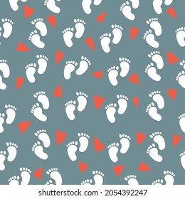 Seamless baby pattern of baby feet. Vector illustration on a grey background

