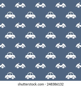 Seamless baby pattern. Many small white cars on blue background